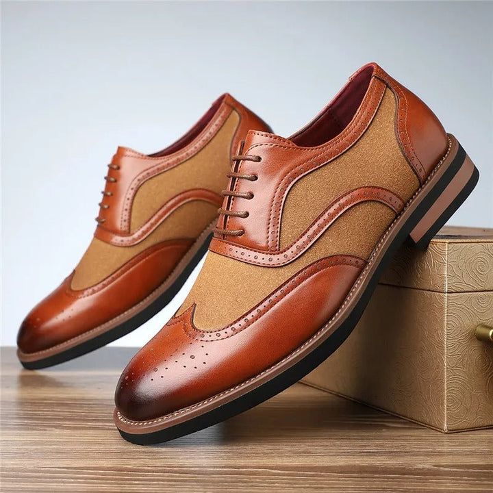 Front view of men's two-tone wingtip brogue oxfords, exhibiting quality craftsmanship