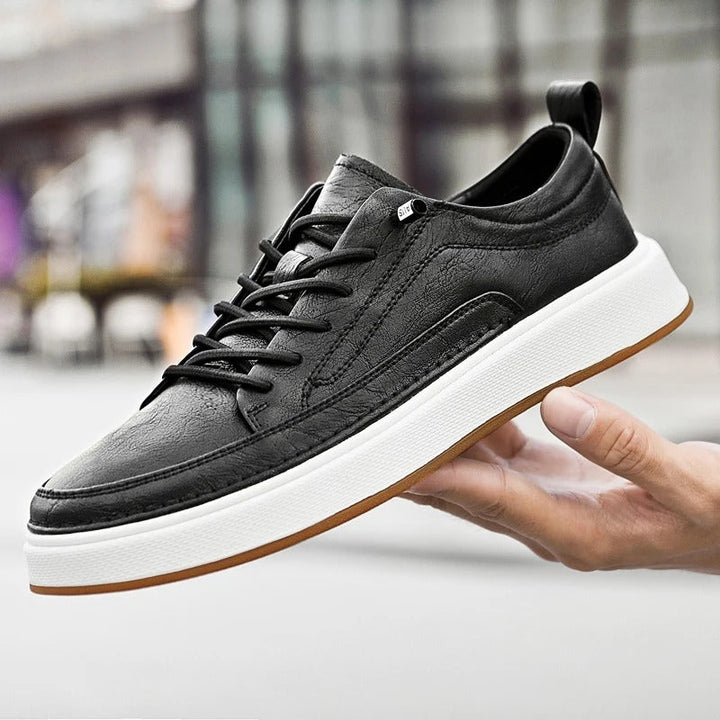 Men's classic dark brown leather sneakers, ideal for casual and urban settings