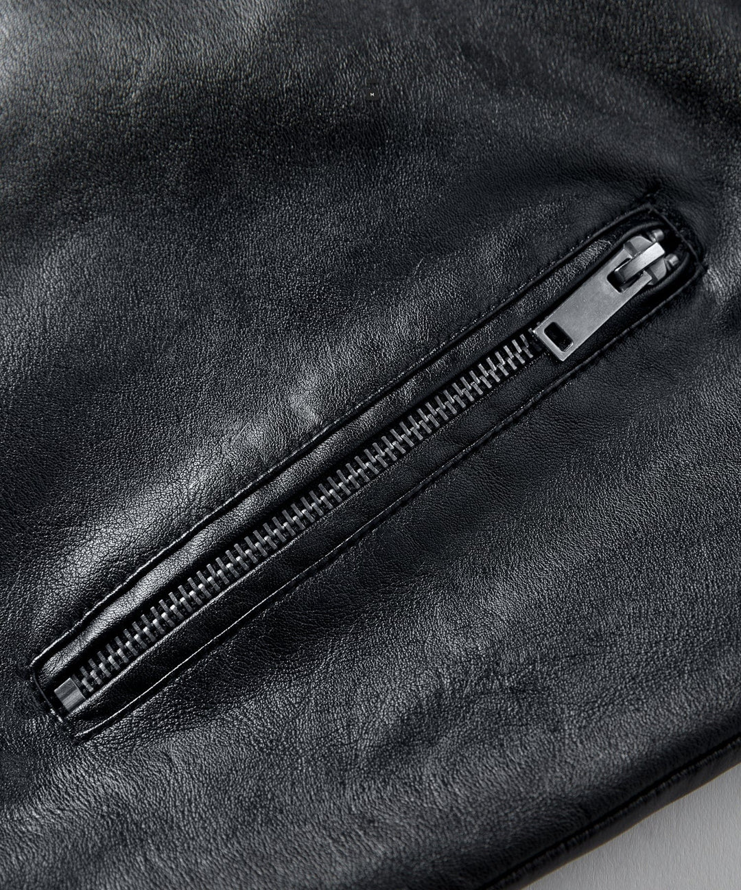 Men's casual jacket in black faux leather, a timeless piece for any fashion-forward man's wardrobe