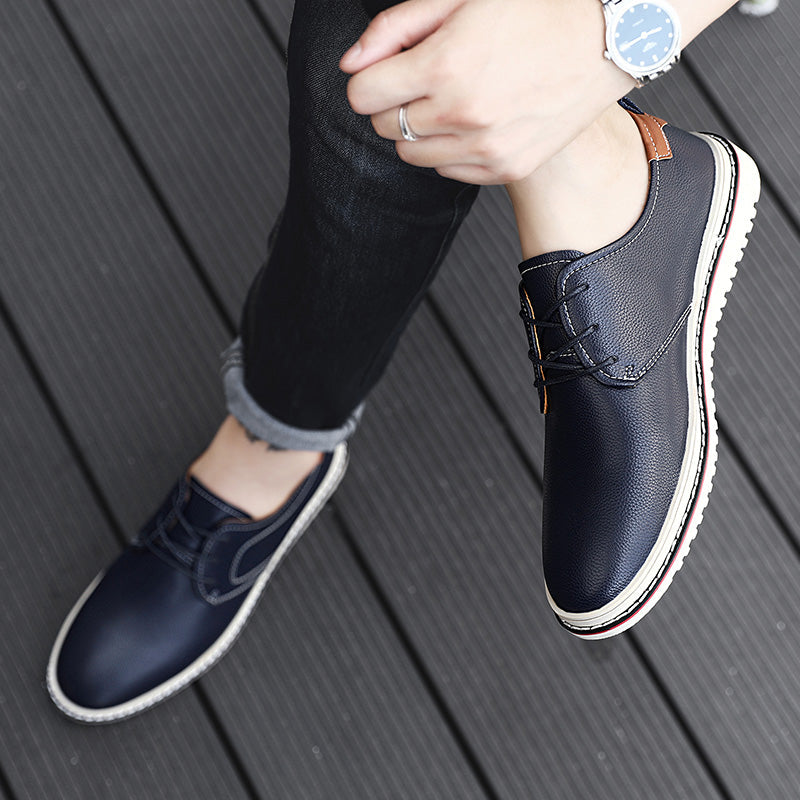Men's urban loafers with subtle design elements and laces, dark blue, versatile footwear