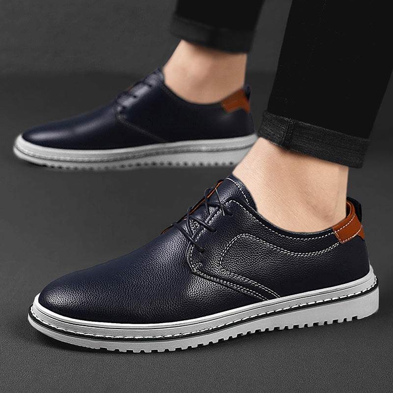 Premium men's urban loafers, deep red, with matching laces, exuding confidence and style
