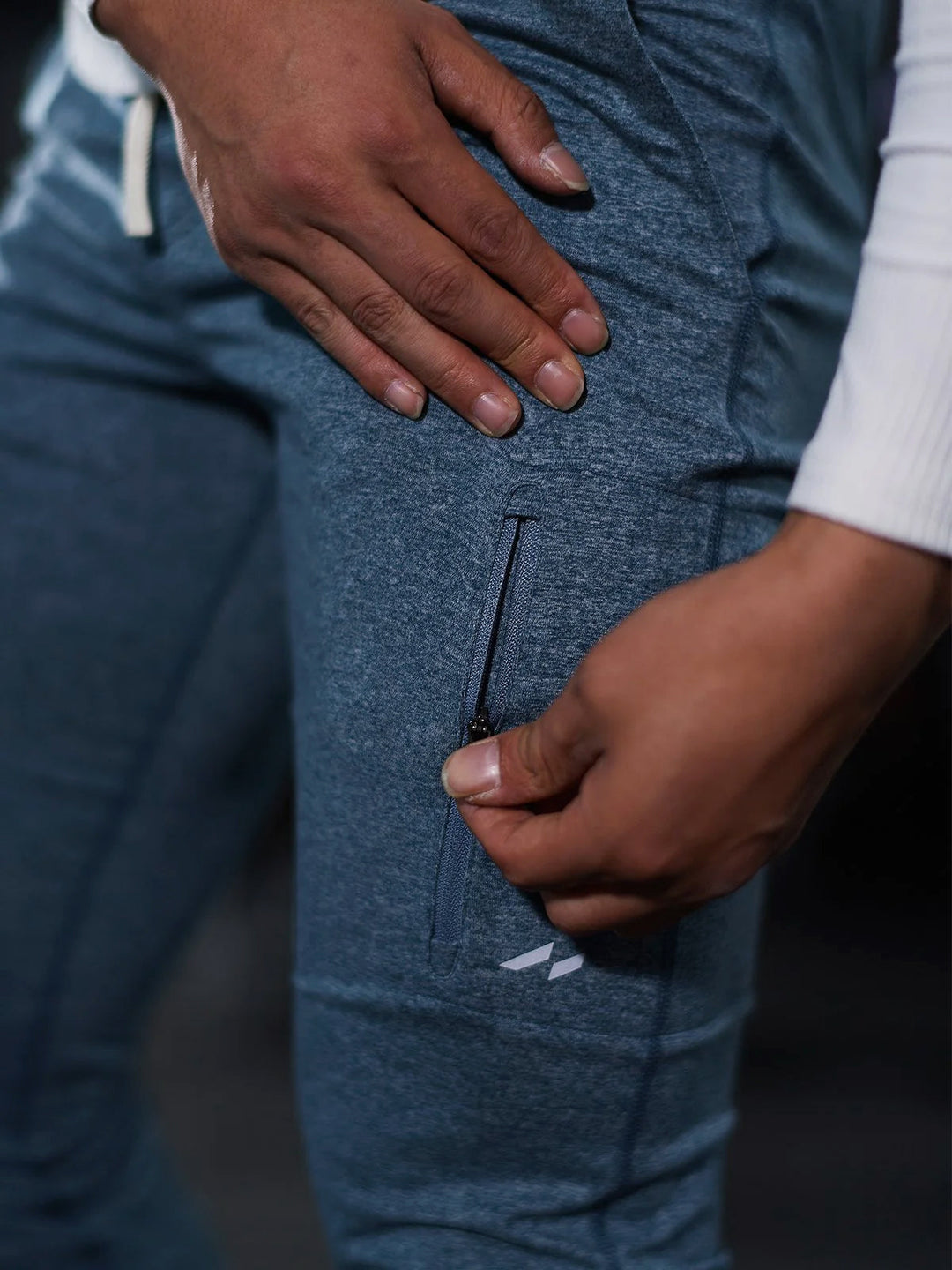 Athlete stretching in Men's Valencia Joggers, highlighting their stretch pants functionality