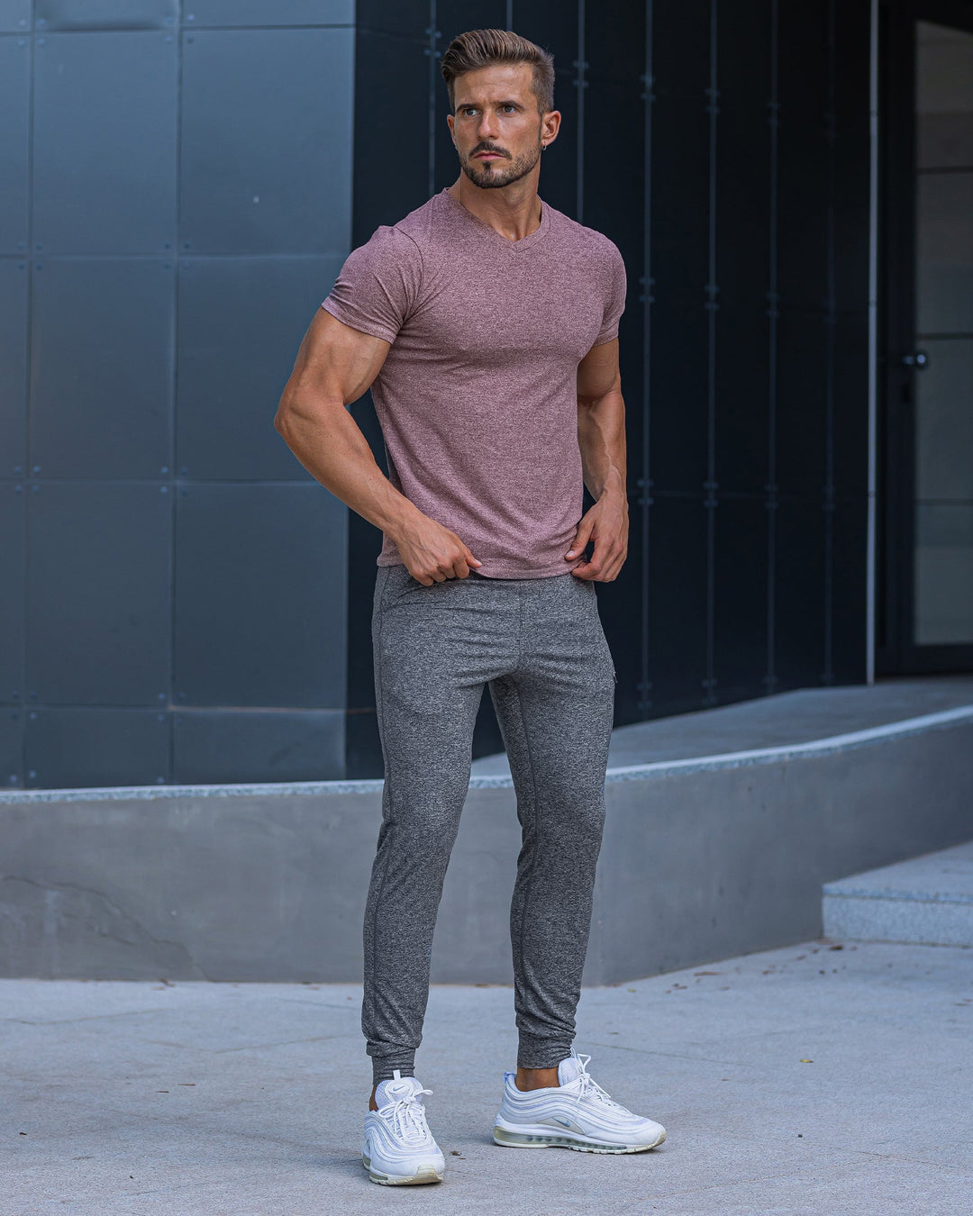 Man relaxing on a couch wearing Men's Valencia Joggers, perfect for loungewear