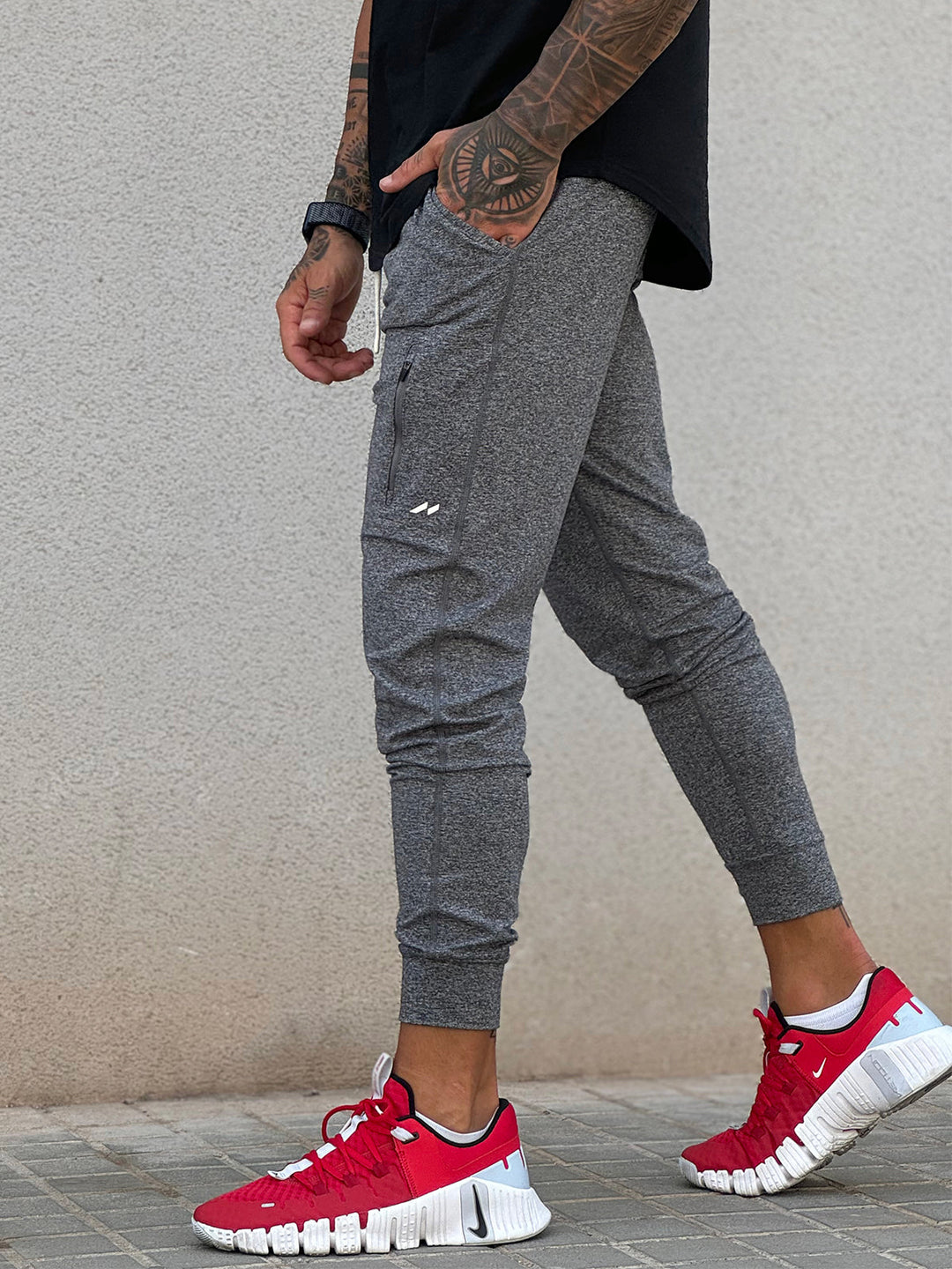 Man performing yoga poses in Men's Valencia Joggers, demonstrating flexibility & stretch