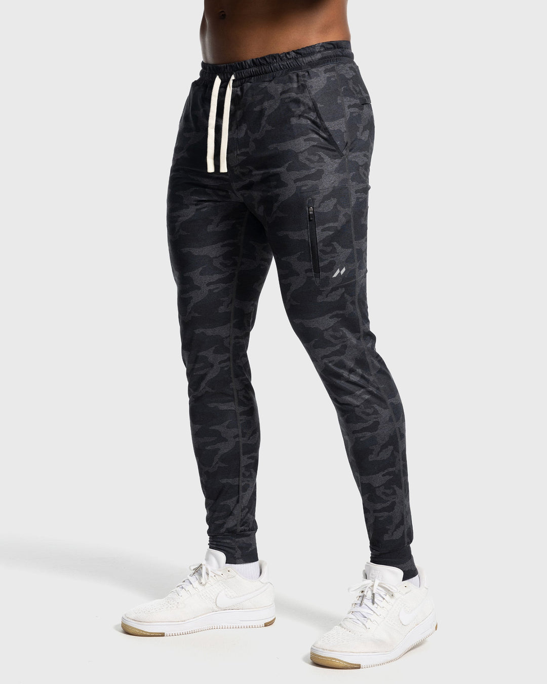 Close-up of the brand logo on Men's Valencia Stretch Joggers, subtle & stylish