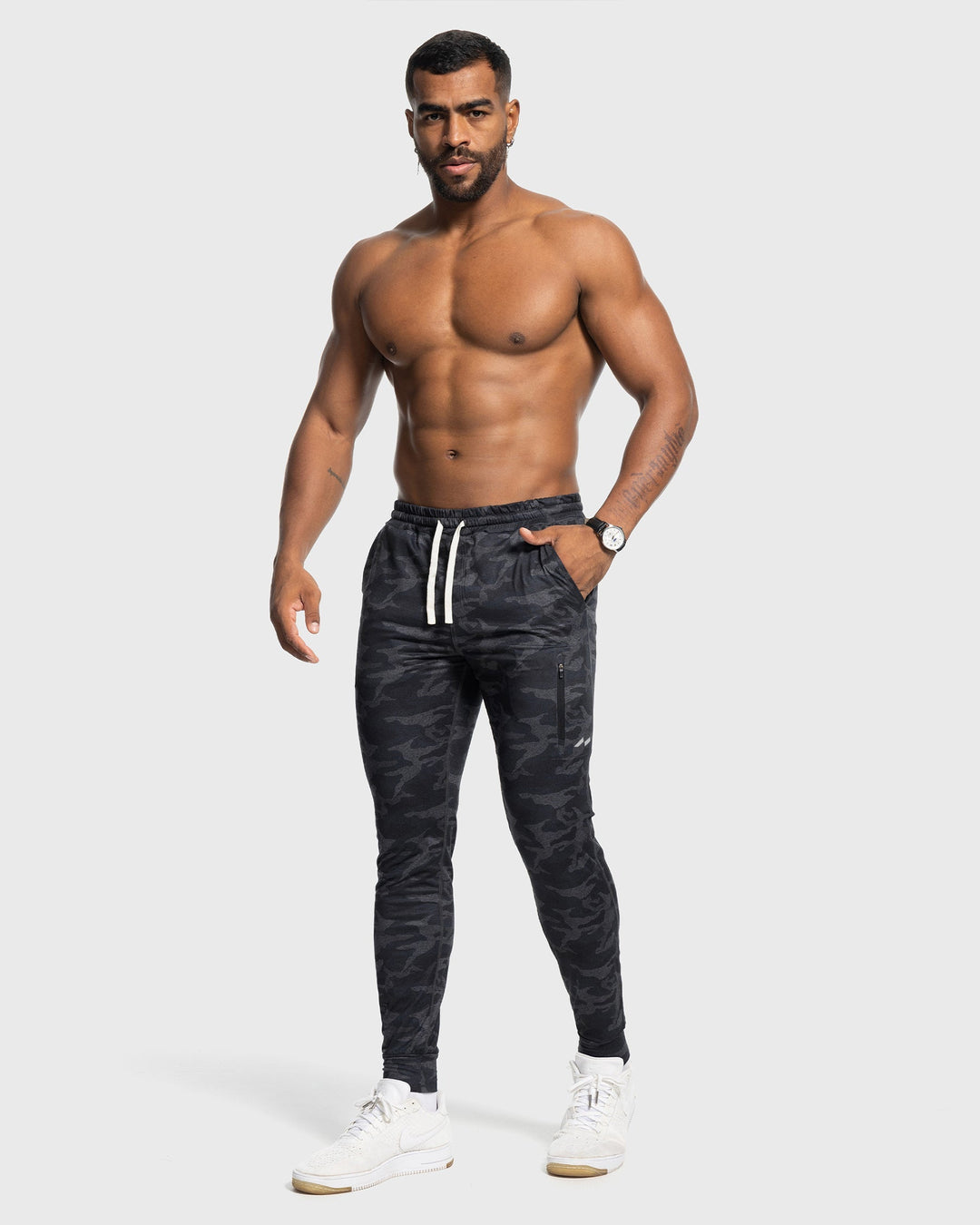 Man wearing Valencia Stretch Performance Joggers, demonstrating freedom of movement & fit