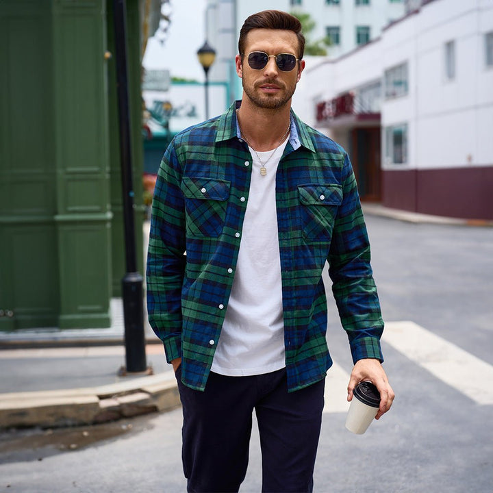 Man working outdoors in a resilient Men's Verona Plaid Flannel Shirt, long sleeve for protection.