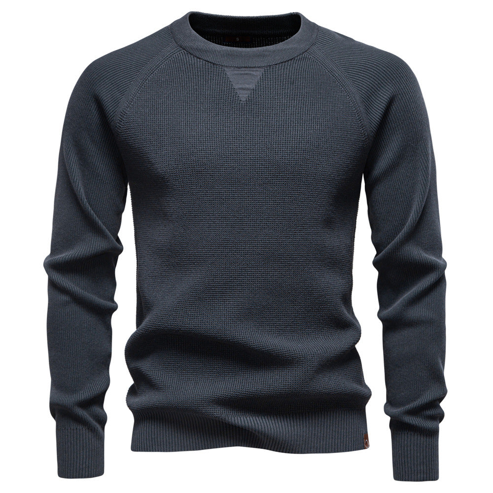 Casual outfit featuring a men's Verona waffle knit sweater paired with jeans.