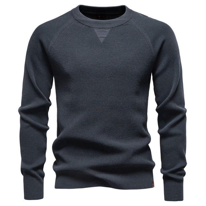 Casual outfit featuring a men's Verona waffle knit sweater paired with jeans.