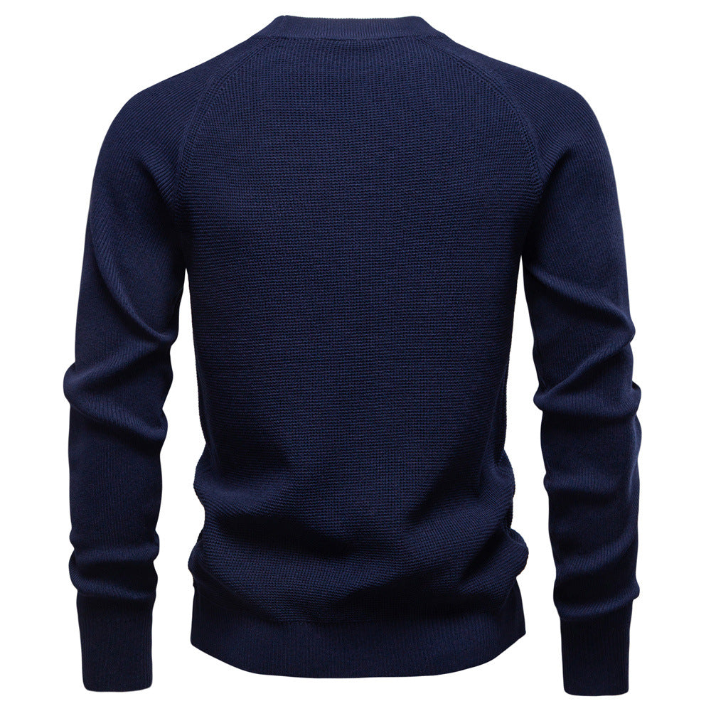 Man posing in a men's blue waffle knit pullover sweater, exuding autumn style.