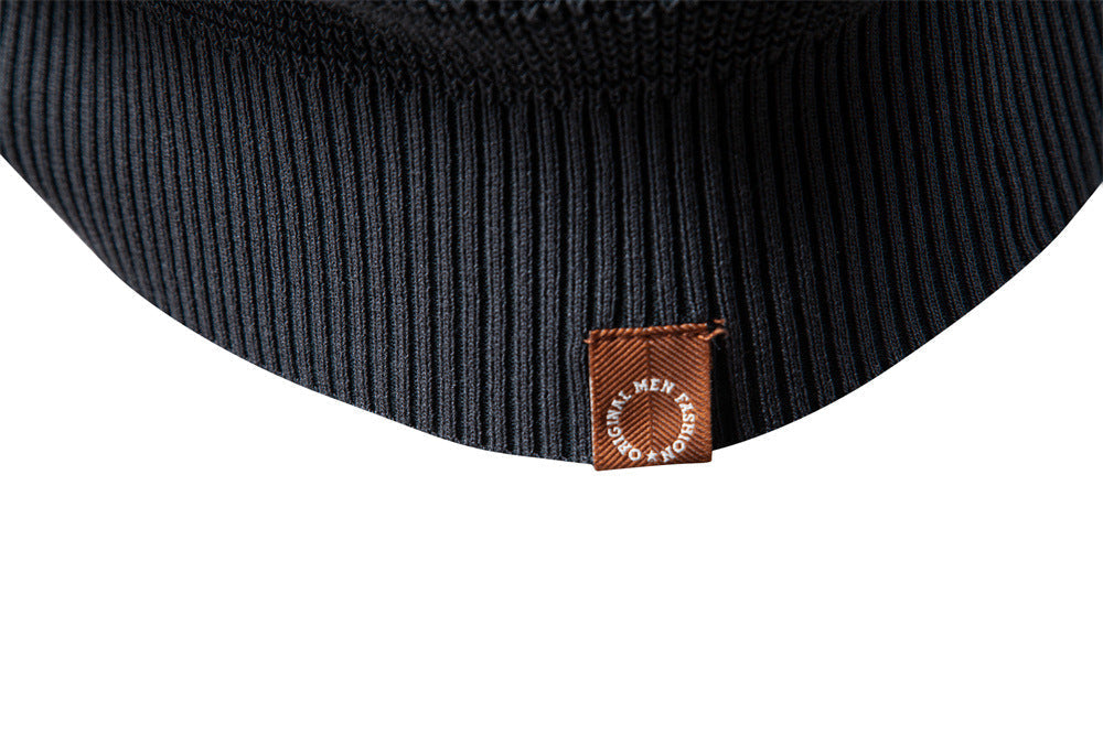 Cozy men's waffle knit pullover in a charcoal grey, essential for cold autumn days.