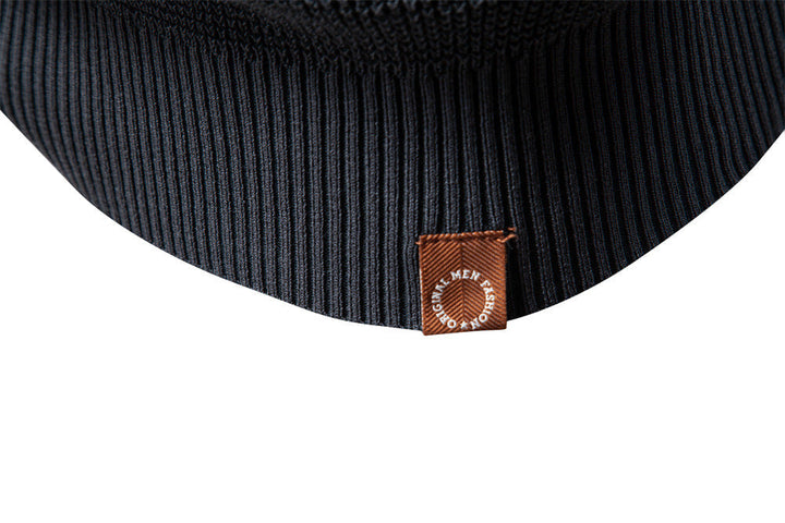 Cozy men's waffle knit pullover in a charcoal grey, essential for cold autumn days.