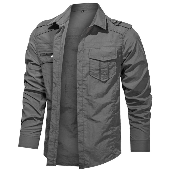 Lifestyle image of a man wearing a weather-resistant soft shell shirt, enjoying an outdoor activity.