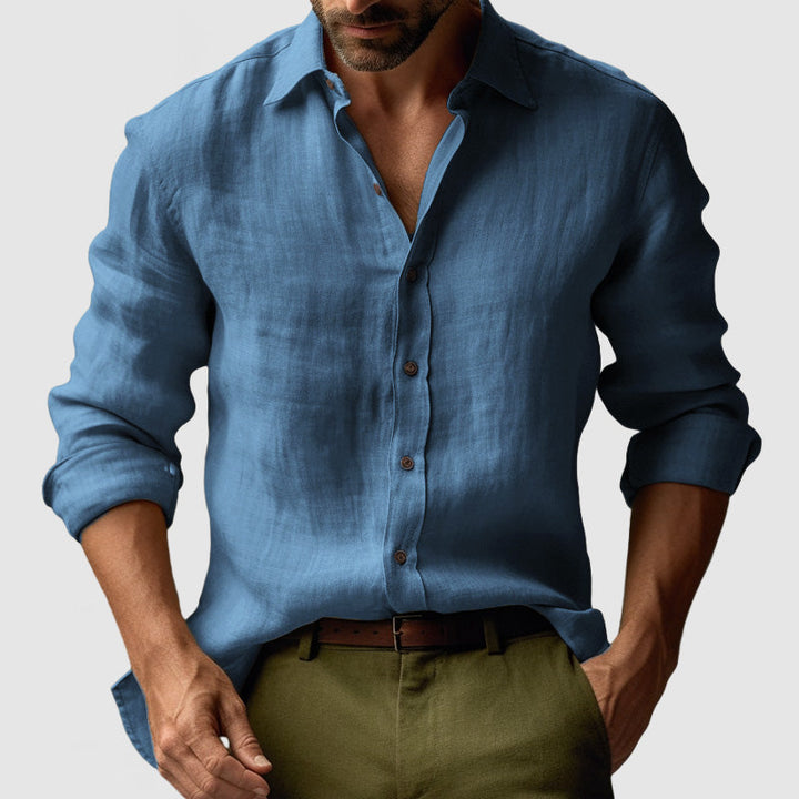 Man wearing men's vintage long-sleeve button-up shirt, styled smart-casually for spring fashion. Comfortable.