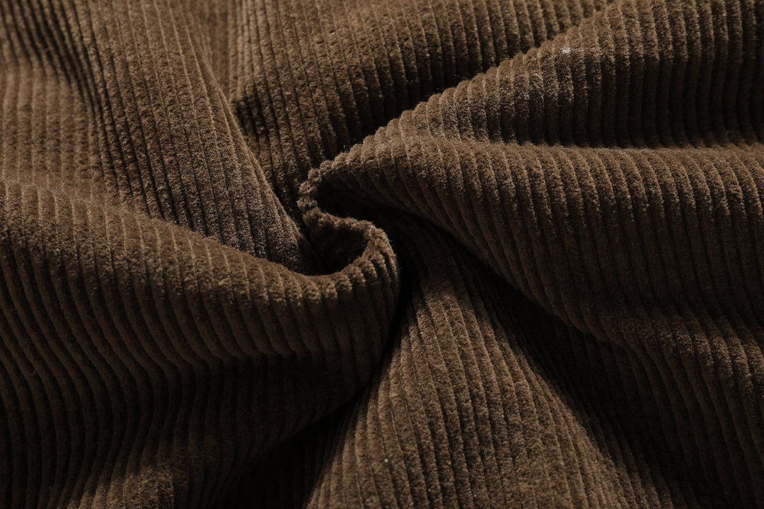 Close-up of cotton blend fabric texture on men's vintage sherpa-lined bomber jacket, durable outerwear.