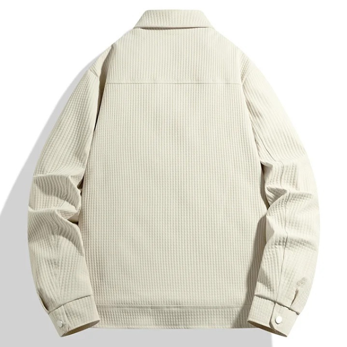 Side profile of a sophisticated men's waffle knit quilted jacket, ideal for casual fall outings.