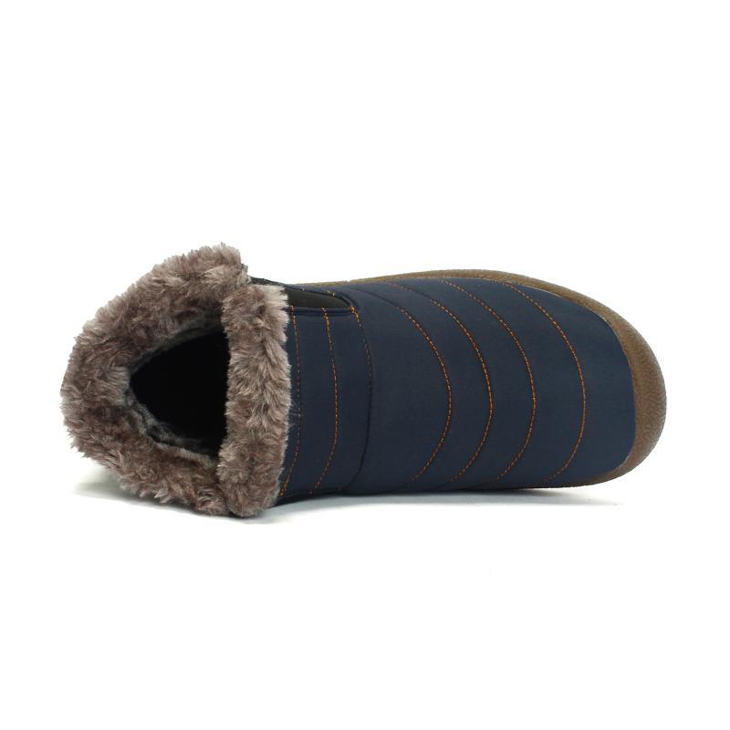 Side profile of men's warm, waterproof hiking boots, perfect for winter adventures