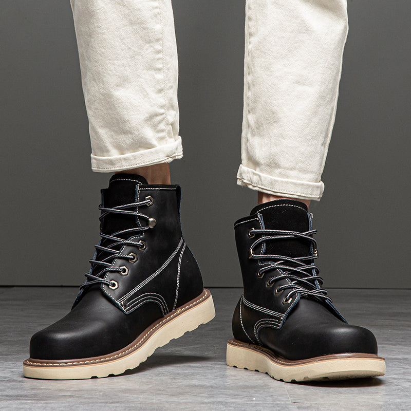 Waterproof men's chukka boots, showcasing their resistance to water droplets on the surface