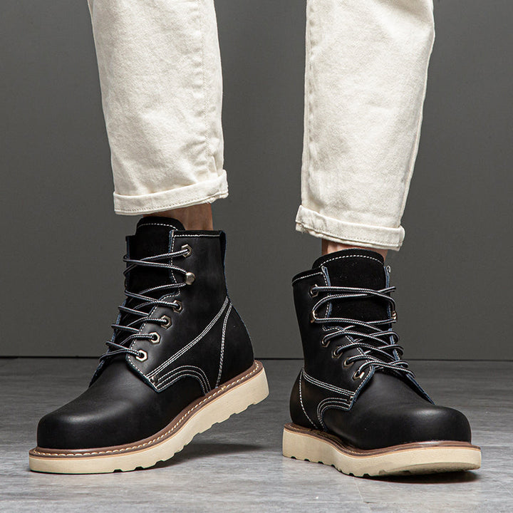 Waterproof men's chukka boots, showcasing their resistance to water droplets on the surface