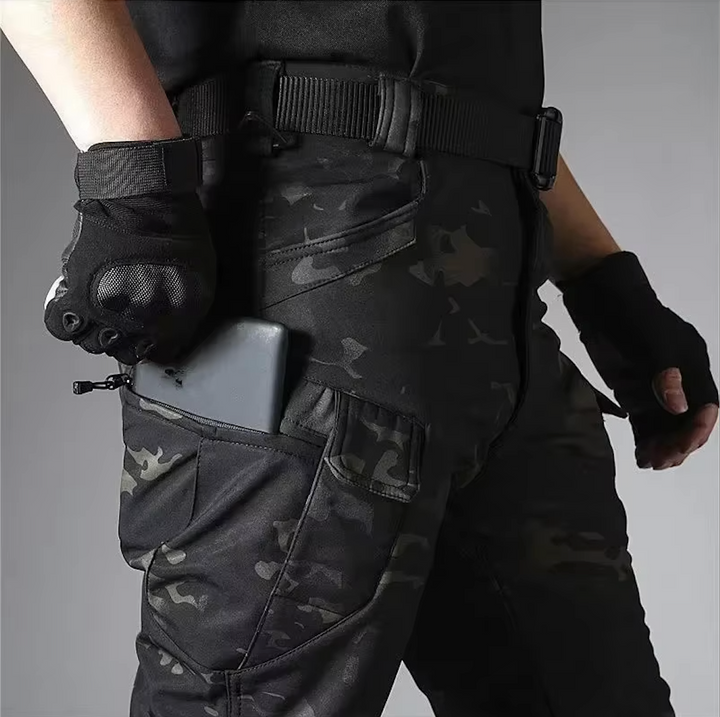 Durable men's outdoor set: waterproof jacket & tactical pants for challenging environments.