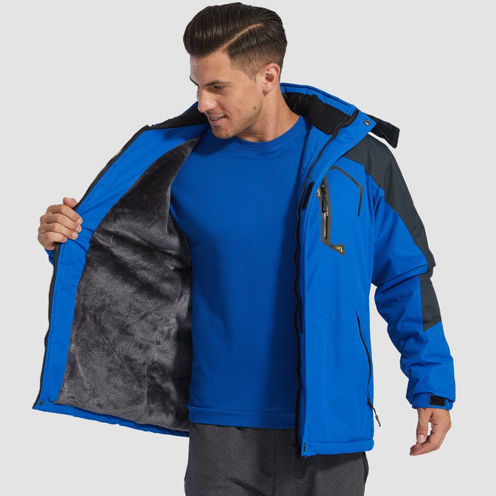 Two-way front zipper on men's blue waterproof jacket, convenience for skiing.