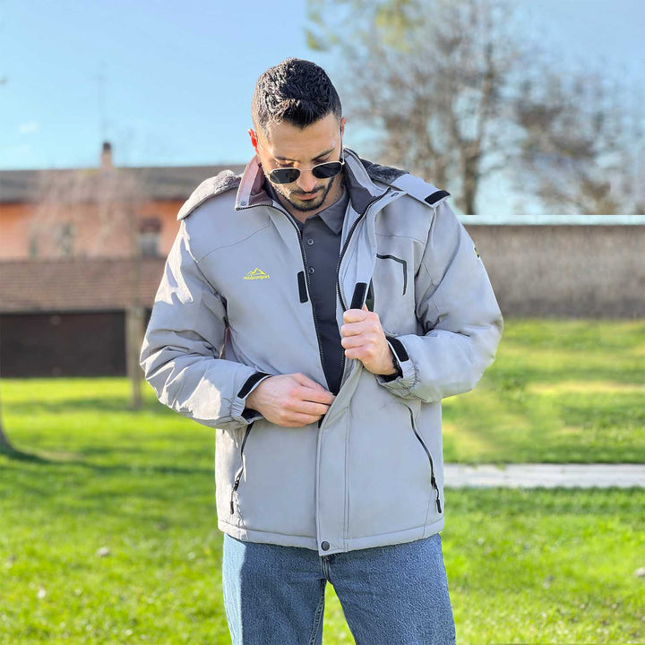 Side zipper pockets on men's black waterproof jacket, ample storage space.