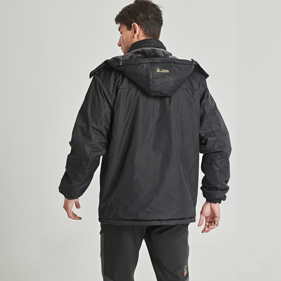 Goggle wipe in pocket of men's red ski jacket, practical feature.