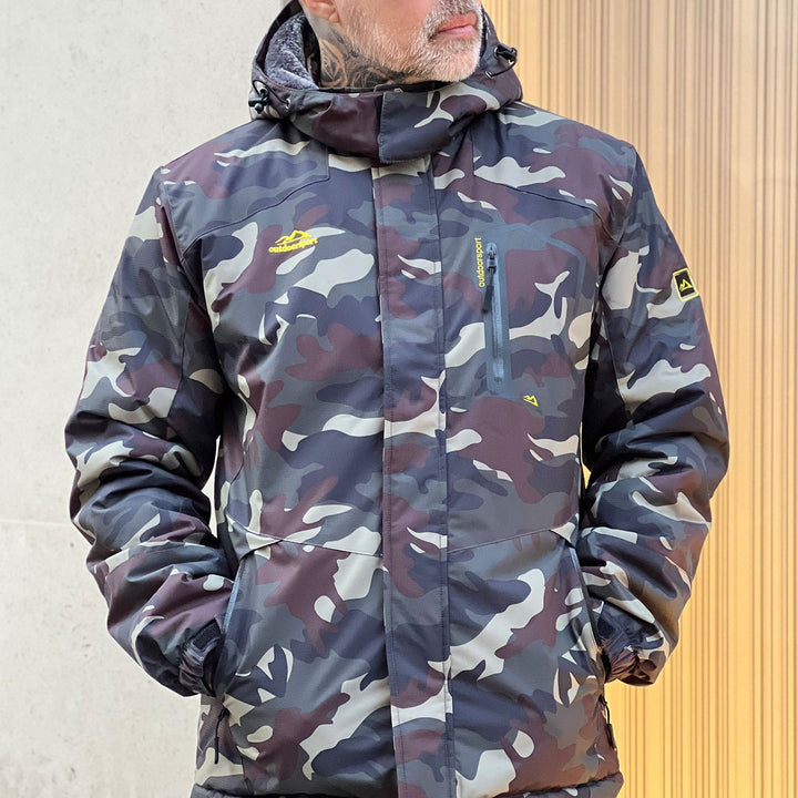Group of friends wearing men's ski jackets, various colors, on a ski trip.