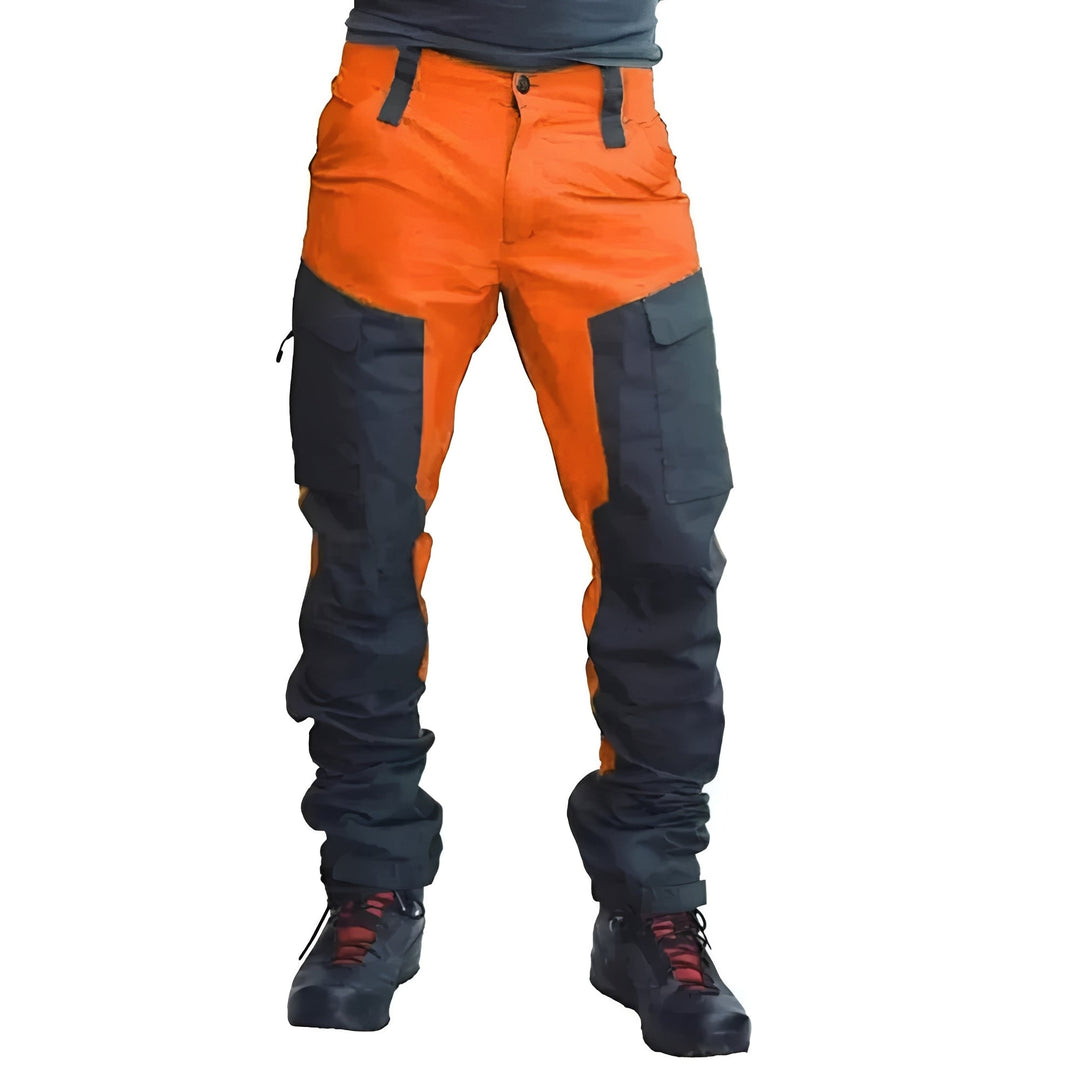 All-weather men's utility pants, tough and weatherproof, ideal for outdoor work with reinforced seams & cargo pockets.