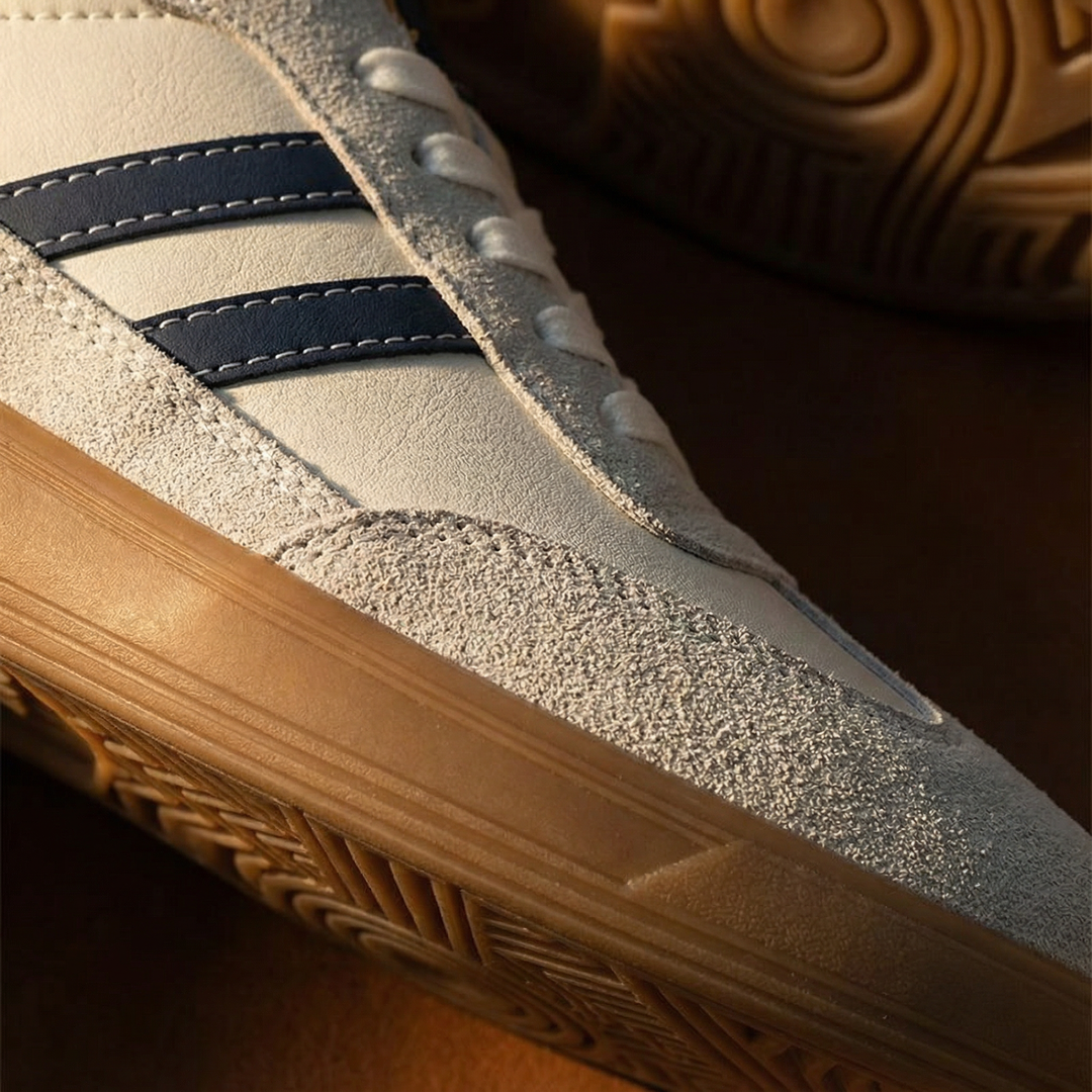 Brown athletic casual footwear for men, comfortable trainer sneakers with a classic leather mesh design.