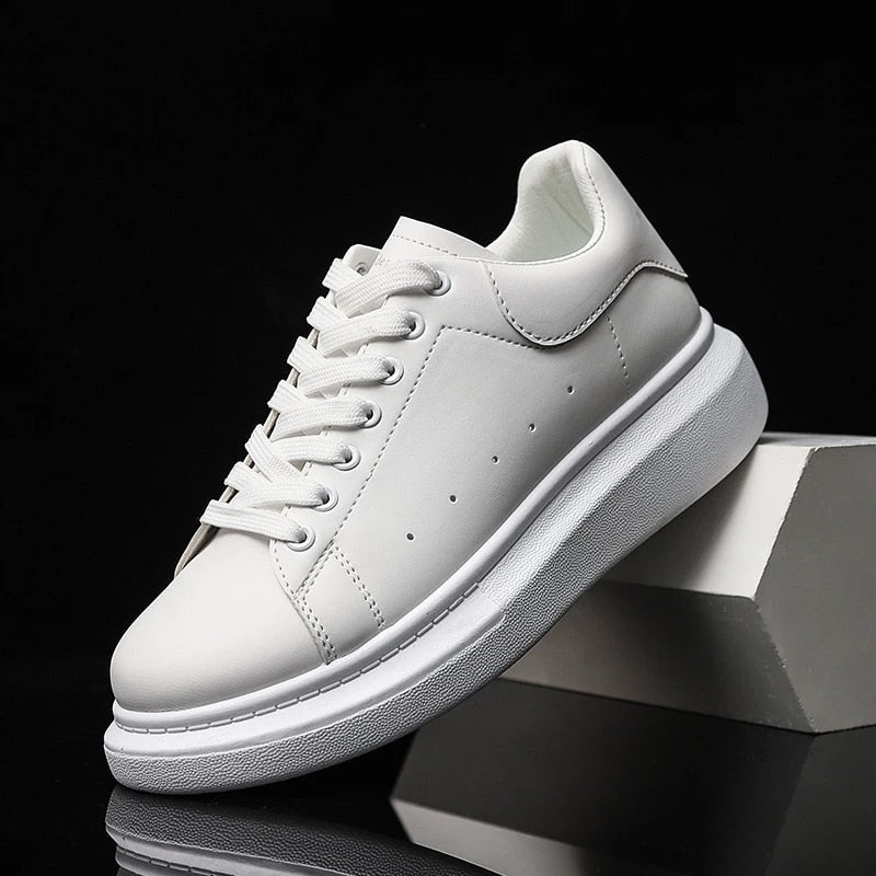 Stylish men's platform sneakers, white with a chunky sole, offering comfortable lace-up design for casual wear.