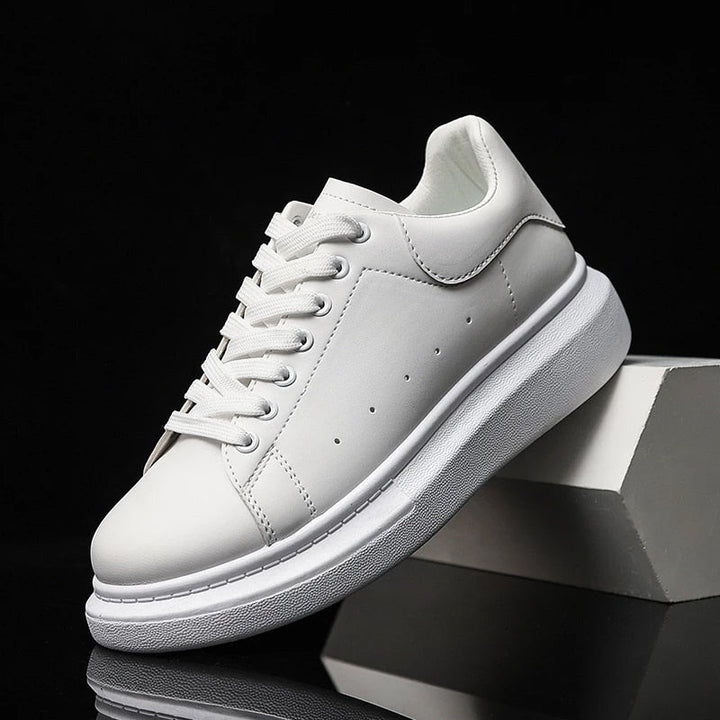 Stylish men's platform sneakers, white with a chunky sole, offering comfortable lace-up design for casual wear.