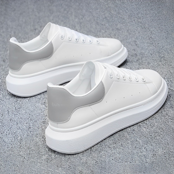 Comfortable men's white platform casual sneakers. Lace-up footwear with a stylish chunky sole for daily wear.