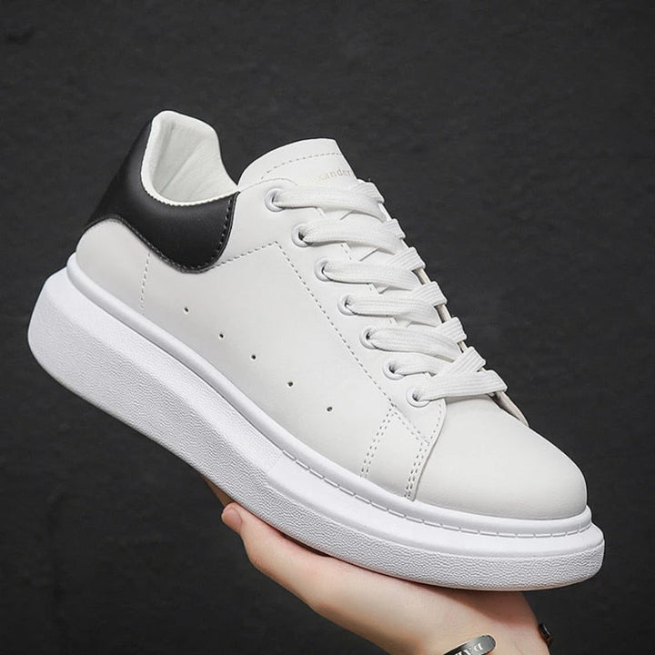 Lace-up men's platform sneakers, white casual shoes with a chunky sole for modern, comfortable everyday fashion.
