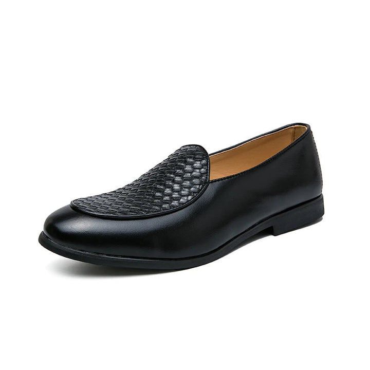Close-up of intricate woven leather detail on men's slip-on loafers, showcasing craftsmanship