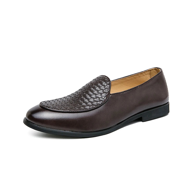 High-angle shot of versatile men's black woven leather loafers, a footwear essential