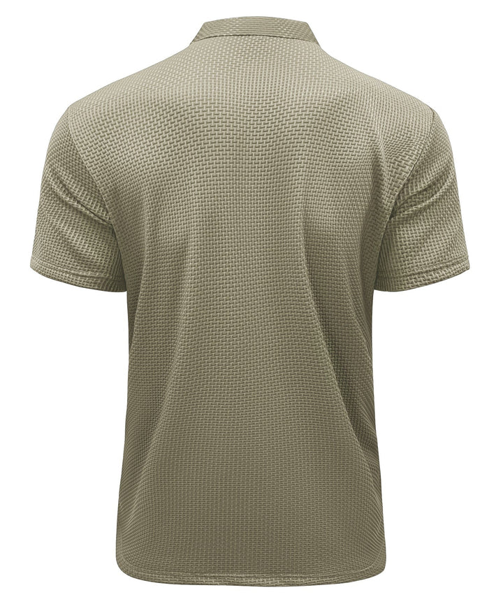 Stack of folded men's wrinkle-free performance polo shirts in assorted colors, ready for wear