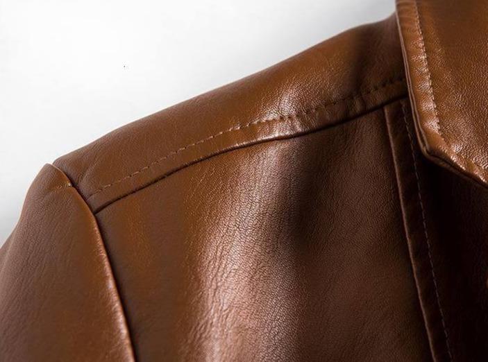 Side profile of men's tailored blazer, showcasing a stylish modern fit and elegant design.