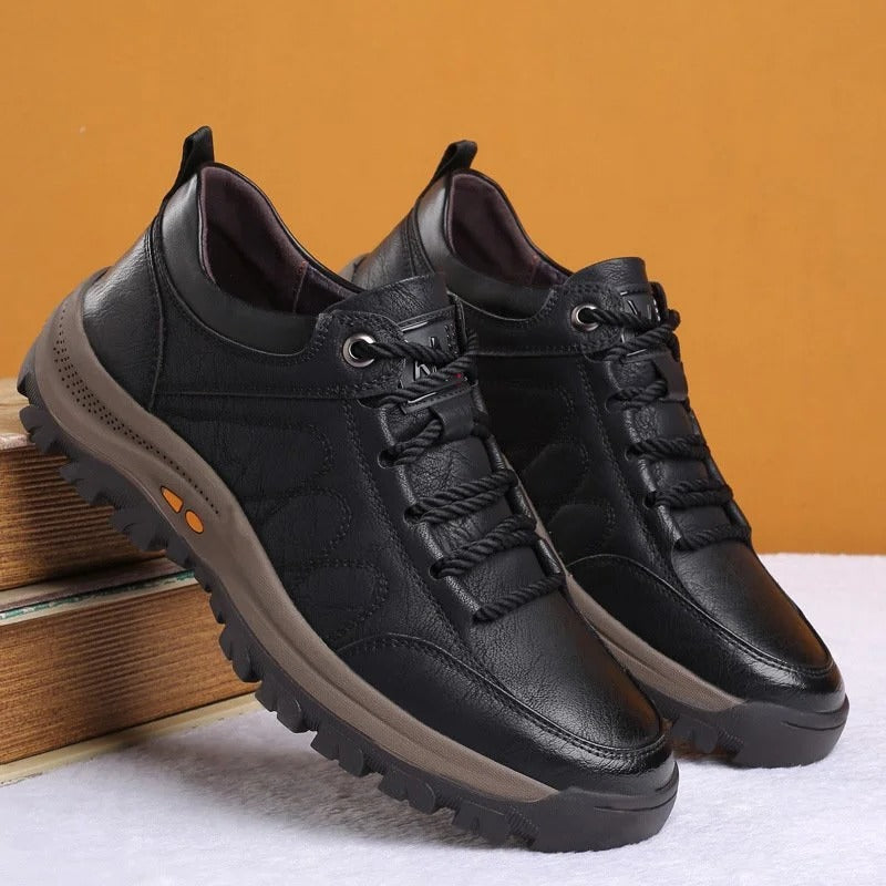 Close-up of men's brown orthopedic shoe sole, highlighting the non-slip rubber tread.