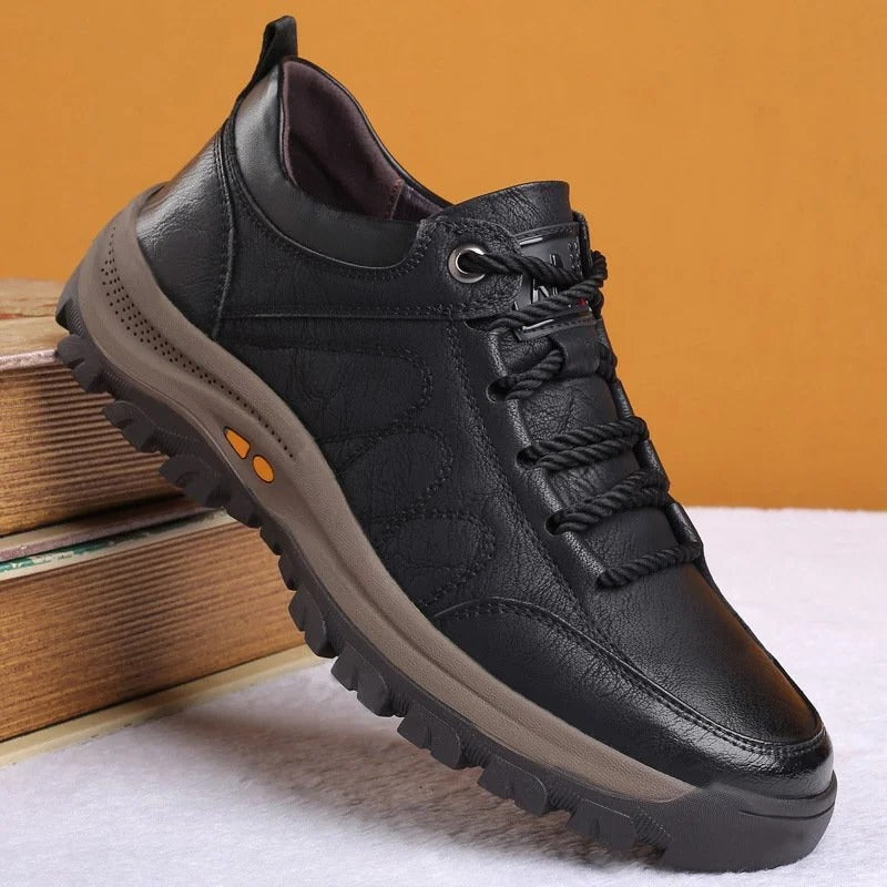 Side view of men's black orthopedic shoe, showcasing its modern casual style.