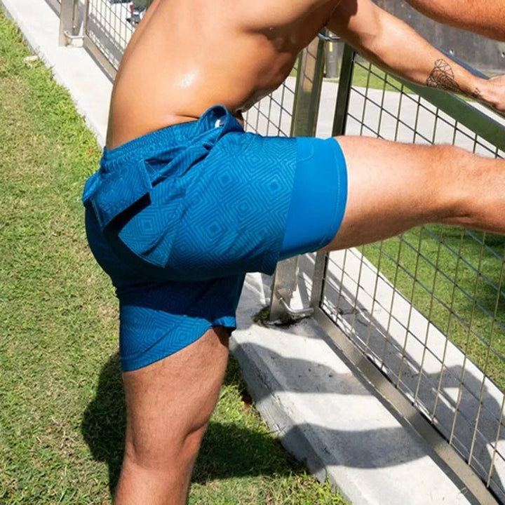 Stylish men's 2-in-1 quick-dry beachwear swim shorts. Comfortable design with compression liner, great for summer fitness.
