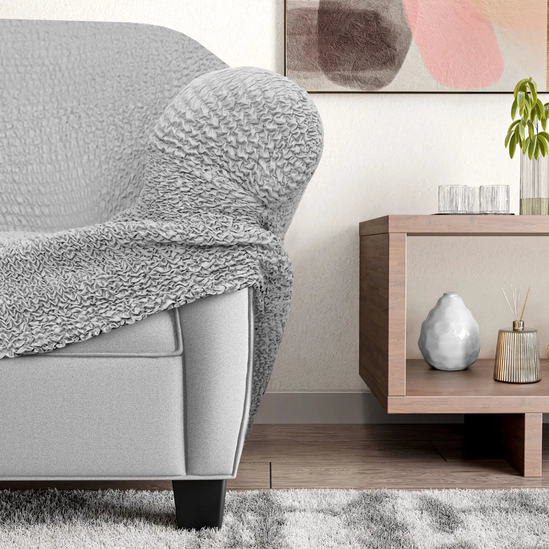 "Microfiber 3-seater recliner slipcover in light grey, versatile fit; transforms decor with protective, stylish cover."