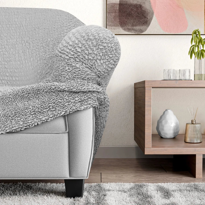 "Microfiber 3-seater recliner slipcover in light grey, versatile fit; transforms decor with protective, stylish cover."