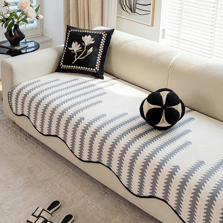Durable chevron sofa cover with modern wavy edges. Non-slip couch protector for stylish living room decor.