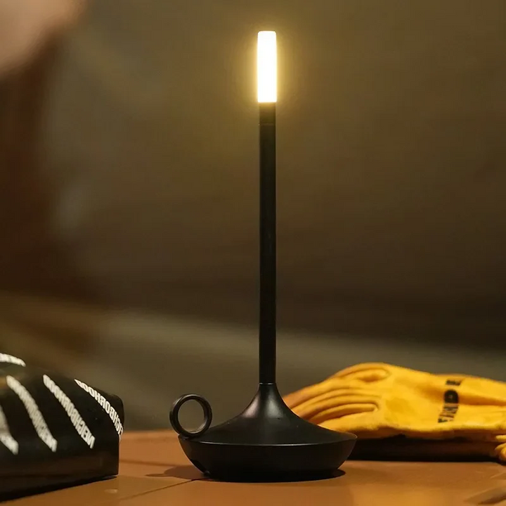 "Modern cylindrical rechargeable touch table lamp with adjustable brightness, ideal for ambient lighting in any space."
