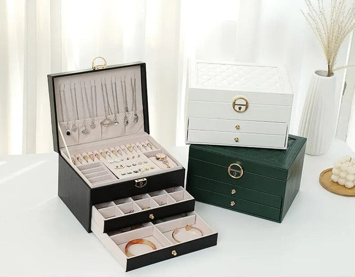 Empty 3-tier jewelry organizer showcasing various compartments for different jewelry types & storage.