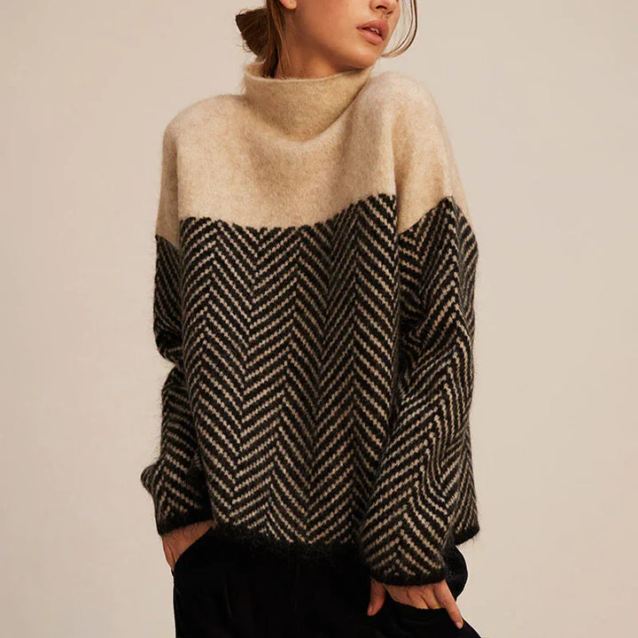 Navy blue herringbone knit sweater with stand-up collar, soft texture, relaxed fit. Women's hoodies and sweaters collection.