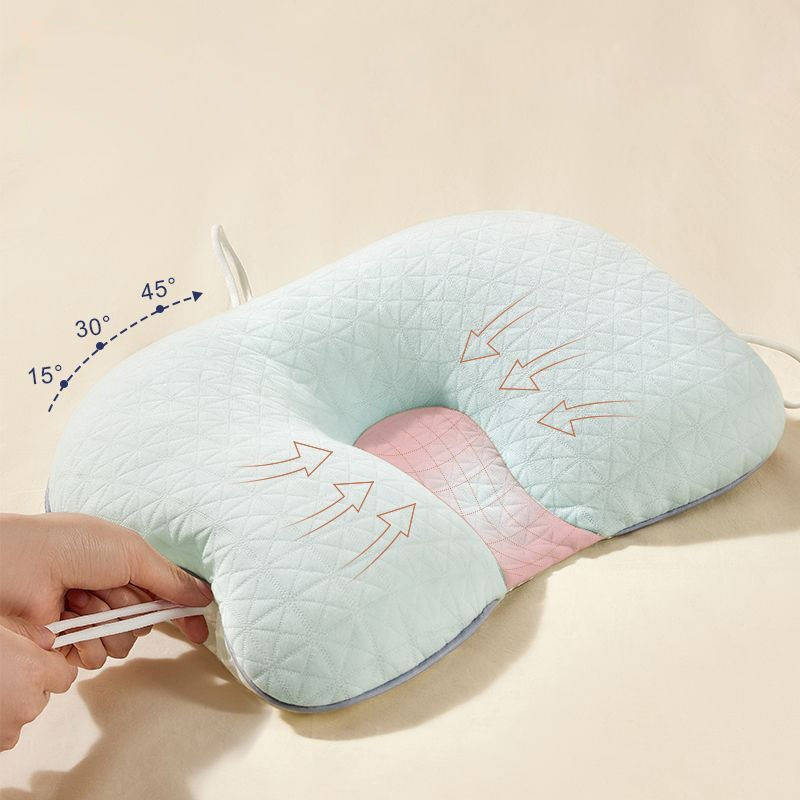 Soft white baby pillow for flat head prevention & comfortable sleep; a nursery essential for infants & toddlers.