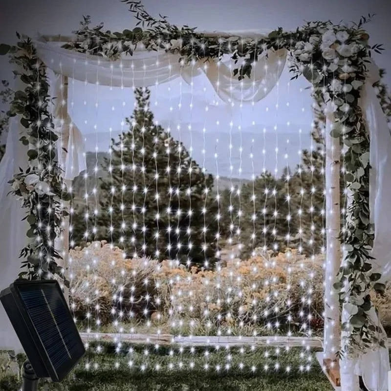 Durable outdoor solar curtain lights, adding ambient glow to garden landscapes.
