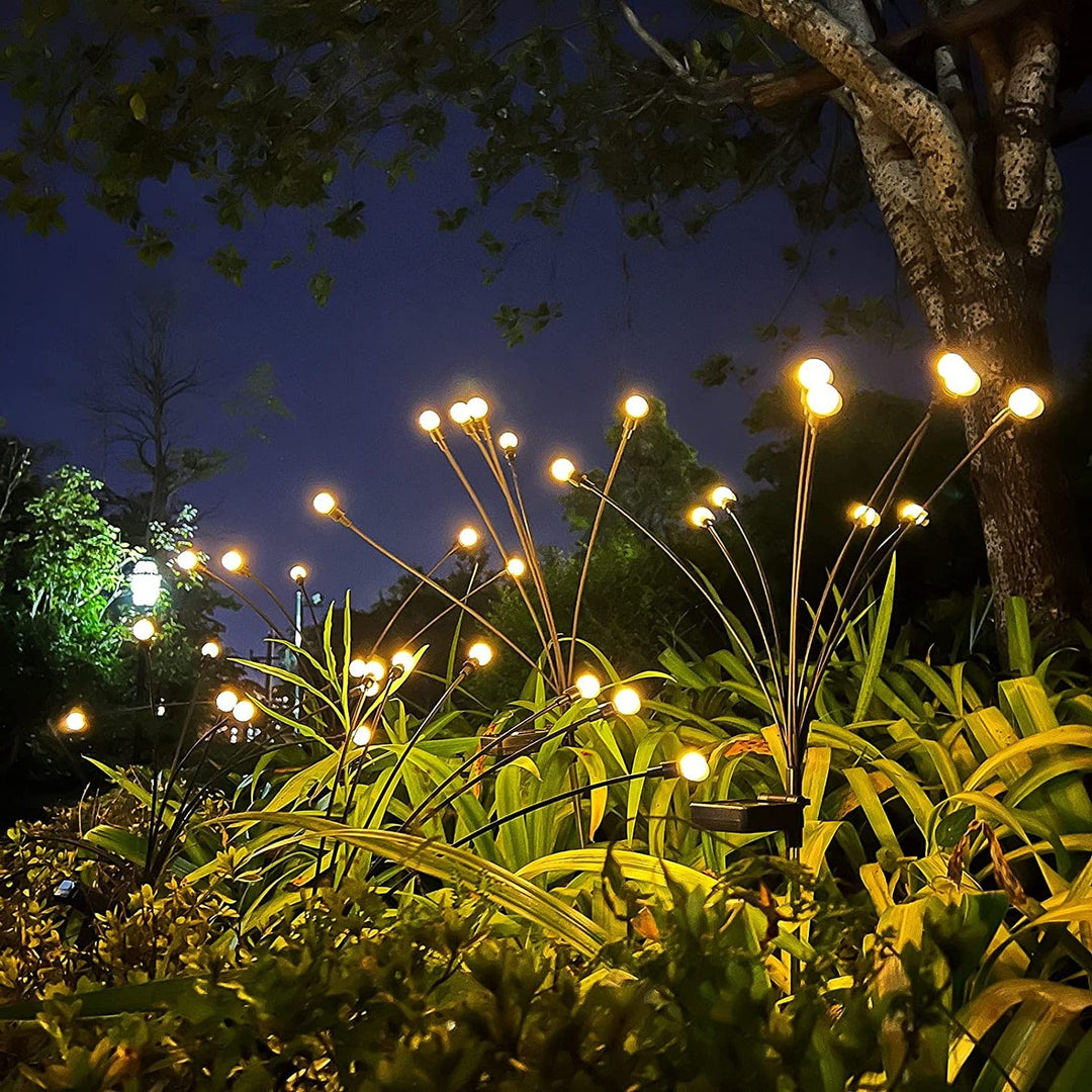 "Outdoor solar firefly garden lights with glowing LED bulbs on tall stakes, IP65 waterproof for enchanting yard decor."